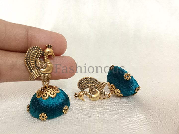 Sky blue silk thread earring with peacock stud