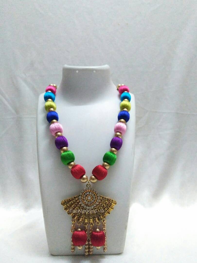Multicolour necklace with antique pendant
