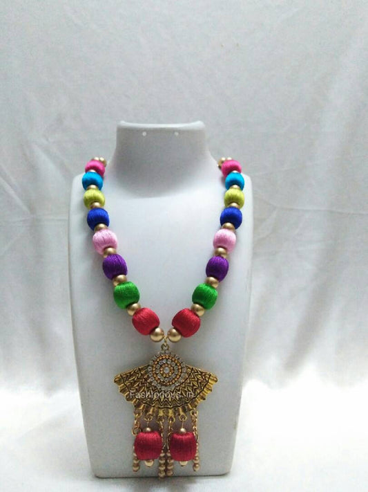 Multicolour necklace with antique pendant